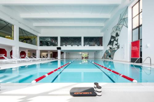 an indoor swimming pool with a swimming pool at WISH Aqua&SPA Resort in Vishenki