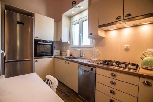 Kuchyň nebo kuchyňský kout v ubytování Sofelia Home