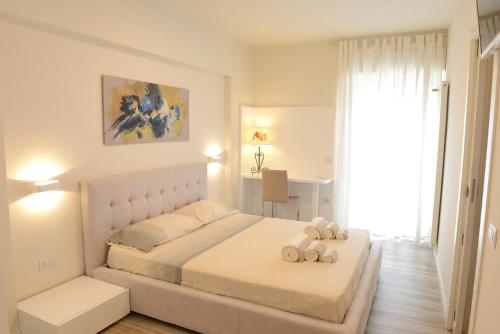 アルゲーロにあるIl Colibrìのベッドルーム1室(ベッド1台、動物2匹の詰め物付)
