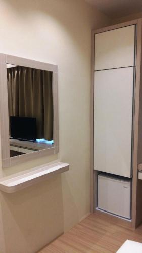 a room with a window with a television in it at Star Tree Homestay -Contactless Self Check in in Kuantan