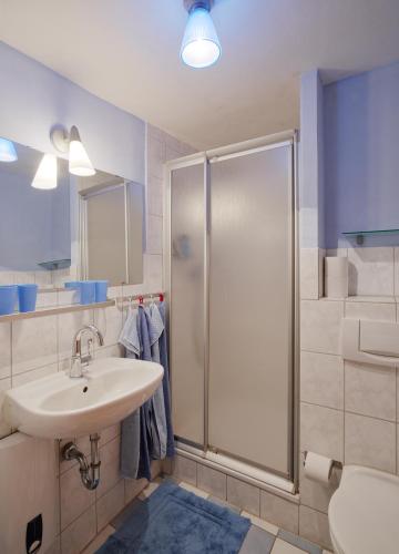 a bathroom with a sink and a shower at Ferienhaus Wagner in Bernkastel-Kues