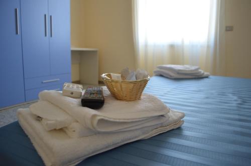 Un ou plusieurs lits dans un hébergement de l'établissement Hotel Happy