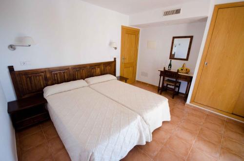 Ένα ή περισσότερα κρεβάτια σε δωμάτιο στο Hotel Club Can Jordi