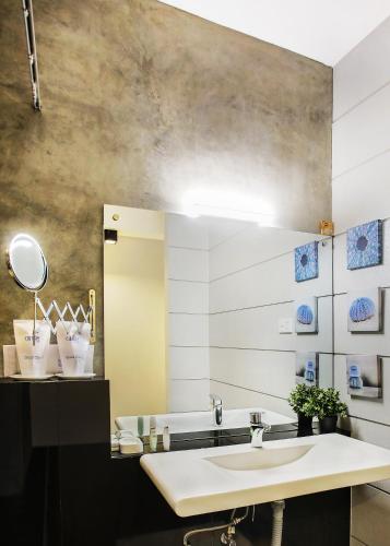 a bathroom with a sink and a mirror at Culture Resort in Matara