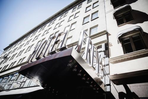 a white building with an awning in front of it at Freys Hotel in Stockholm
