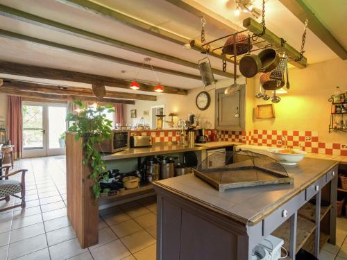 a kitchen with a sink and a counter top at Bièvre Forest-Edge Retreat in Bellefontaine