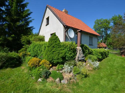 a small house with a garden in the yard at Beautiful holiday home in Svinarov Bohemia in the Czech Republic with a garden in Svinařov