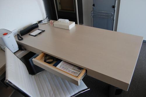 an office cubicle with a desk with a drawer at X wave Funabashi in Funabashi