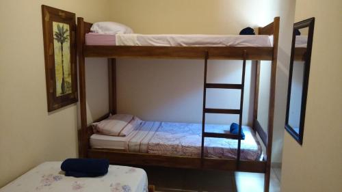 two bunk beds in a room with a mirror at CASA BONITA in Bonito