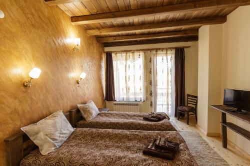 Postel nebo postele na pokoji v ubytování Rupchini Houses