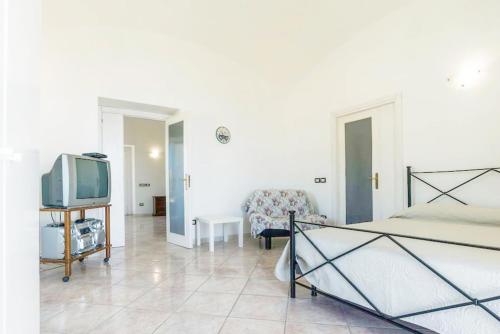 Televízia a/alebo spoločenská miestnosť v ubytovaní La Panoramica