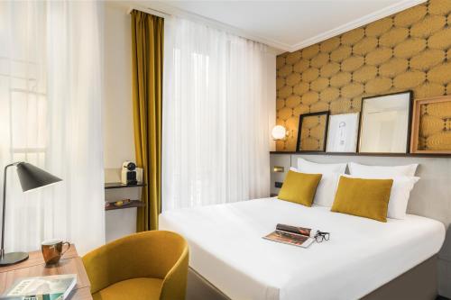 Ein Bett oder Betten in einem Zimmer der Unterkunft Best Western Plus La Demeure