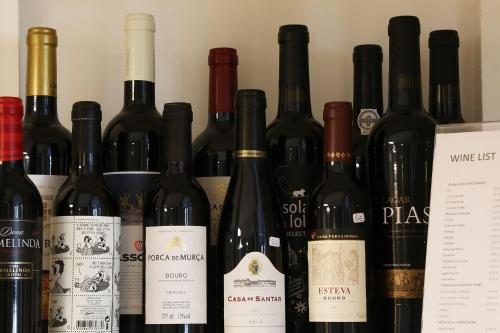 a bunch of wine bottles sitting next to each other at Cosy Sintra in Sintra