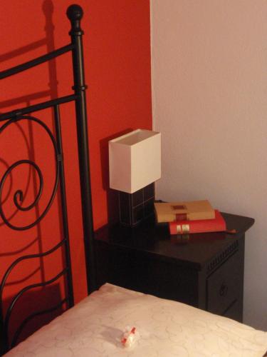 a bedroom with a bed with a box on a desk at TEMPFER 2 Apartments & Rooms with new WELLNESS in Kranjska Gora