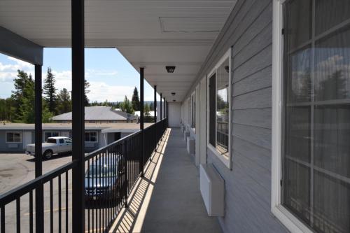 a balcony of a building with a view of a parking lot at Dude & Roundup in West Yellowstone