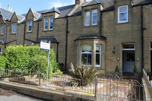 a house with a no parking sign in front of it at Dalmore Lodge Guest House in Edinburgh