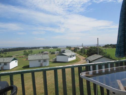 a view from the balcony of a house at Chalets Grand Pre Cottages in North Rustico