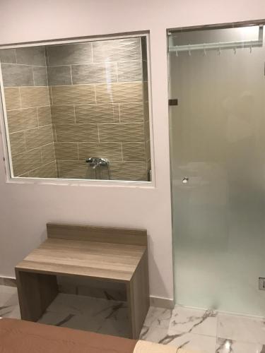 a bathroom with a sink and a shower at Hotel Rex in Thessaloniki
