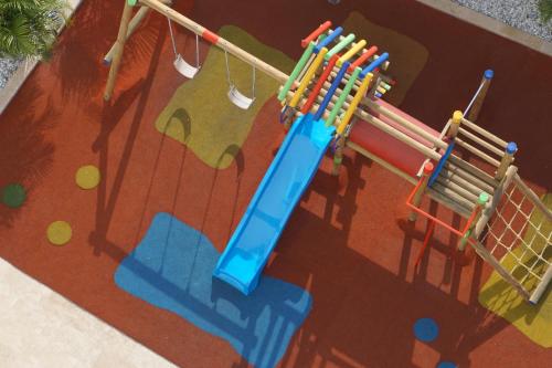 an image of a playground with a play equipment at Mercure Santa Marta Emile in Santa Marta