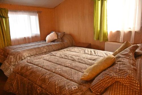 A bed or beds in a room at Cabañas Patagonia Insitu