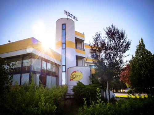 a building with a sign on the front of it at Hotel Select in Atessa