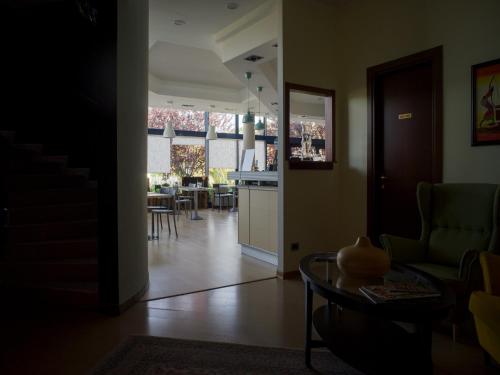 a living room with a kitchen and a dining room at Hotel Select in Atessa