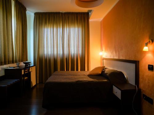 Postel nebo postele na pokoji v ubytování Hotel Select