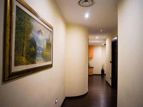 a hallway with a painting hanging on a wall at Hotel Select in Atessa