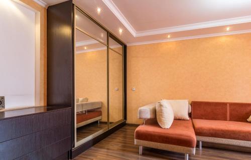 a dressing room with a bench and a mirror at Apartment in the city center in Dnipro