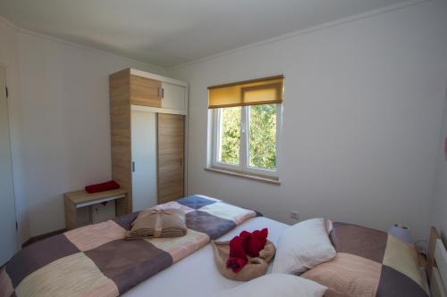 Postel nebo postele na pokoji v ubytování Apartment Krista Tinjan