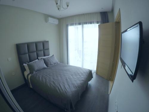 Кровать или кровати в номере Hivernage Founty