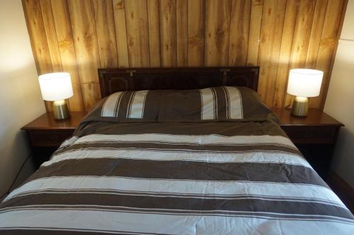 Lova arba lovos apgyvendinimo įstaigoje Vacation Inn Motel