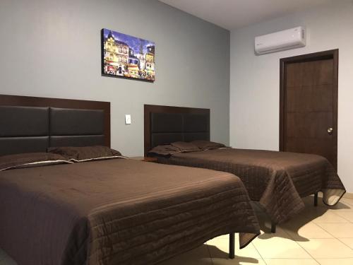 Hotel Real San Javierにあるベッド