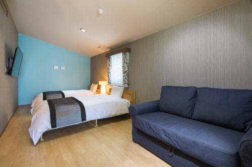 Letto o letti in una camera di Sundance Resort Izukogen ANNEX