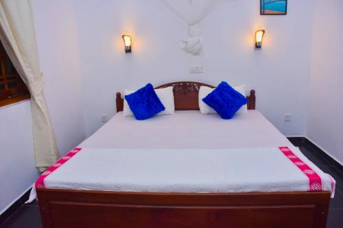 Postel nebo postele na pokoji v ubytování Mali Guest House