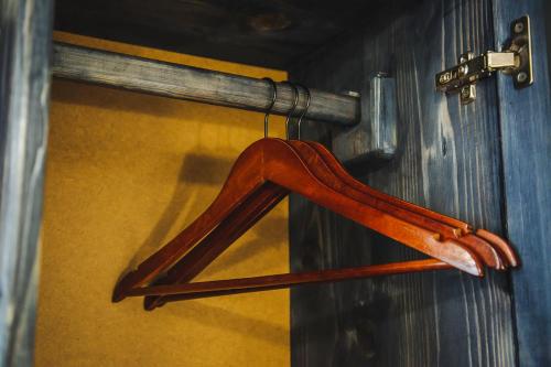 a wooden hanger is hanging on a door at Alina Hotel & Hostel in Uzhhorod