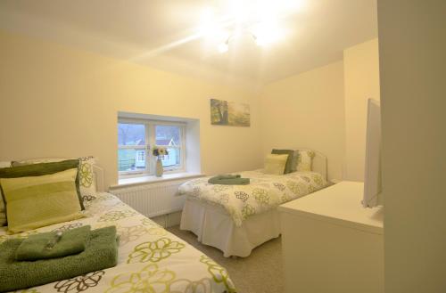 En eller flere senge i et værelse på Rural Coastal Self-Catering Accommodation for 8, Near Sandringham Estate, Norfolk