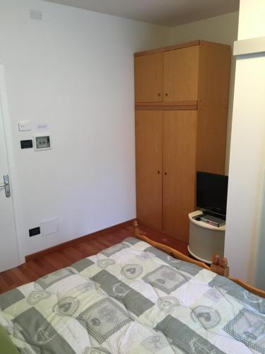 a bedroom with a bed with money on it at Affittacamere Penasa in Rabbi