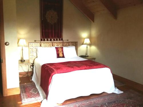A bed or beds in a room at Kentisbury Country House