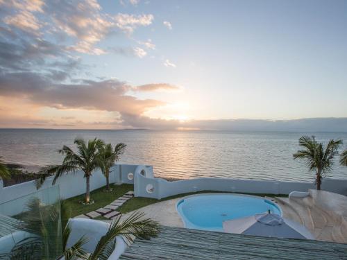 a view of the ocean from the balcony of a resort at Beach House in Vilanculos