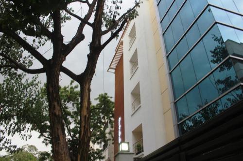 a building with a tree in front of it at Pebbles in Chennai
