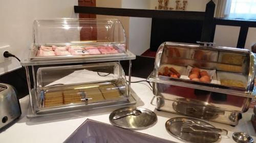 a table with two trays of food on it at Hostinec U Hubálků in Kostelec nad Orlicí