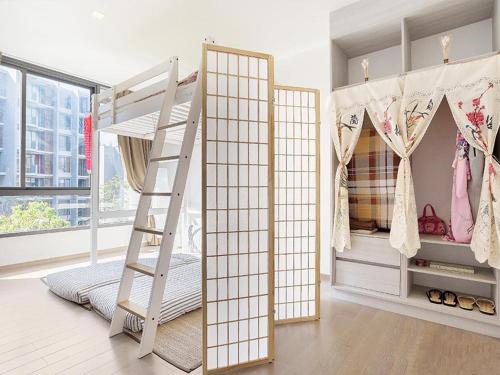a bedroom with two bunk beds and a ladder at Japan Room 104-B KhaoYai at TVL เขาใหญ่ in Phayayen