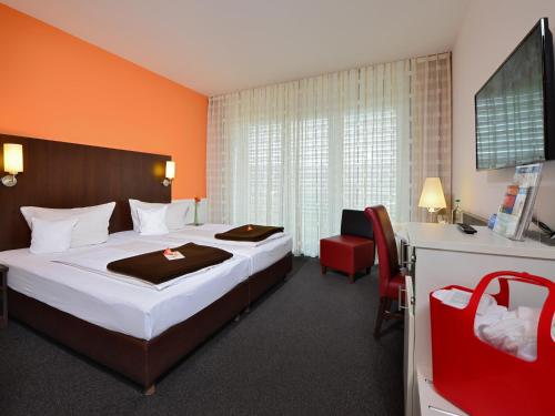 Cama o camas de una habitación en Best Western Plus Konrad Zuse Hotel