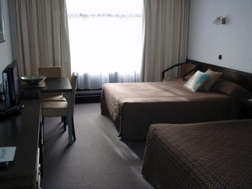 Voodi või voodid majutusasutuse West Coaster Motel toas