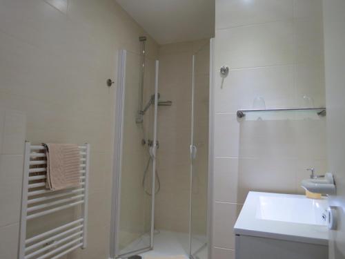 a bathroom with a shower and a sink at Hotel-Pension SCHLOSS -MIRAMAR in Bad Elster