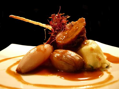 a plate of food with meat and vegetables on a plate at Rufford Arms Hotel in Rufford