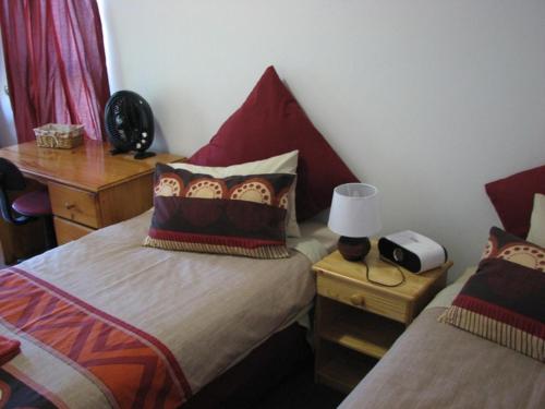 Katil atau katil-katil dalam bilik di Magnolia Place Guest Houses