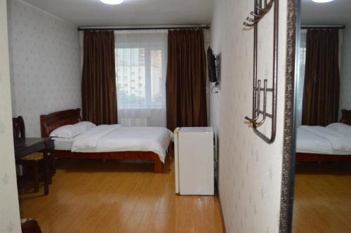 Land Hotelにあるベッド