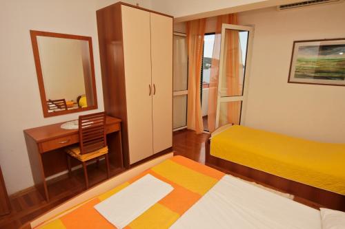 Ένα ή περισσότερα κρεβάτια σε δωμάτιο στο Apartments Toni Two